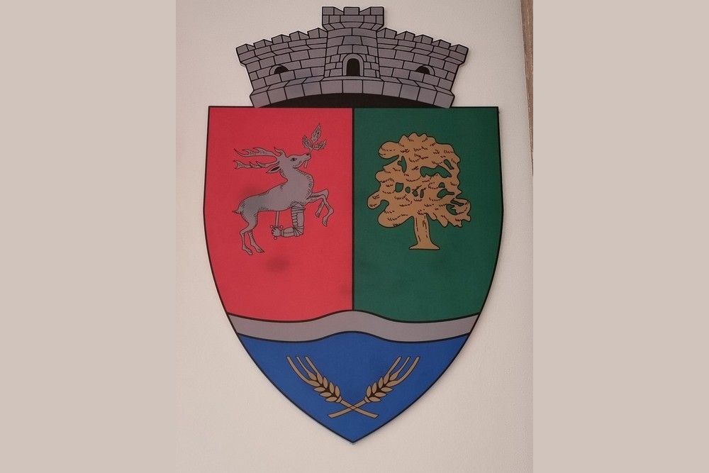 Mit jelképeznek a szimbólumok Mikola község új címerében?